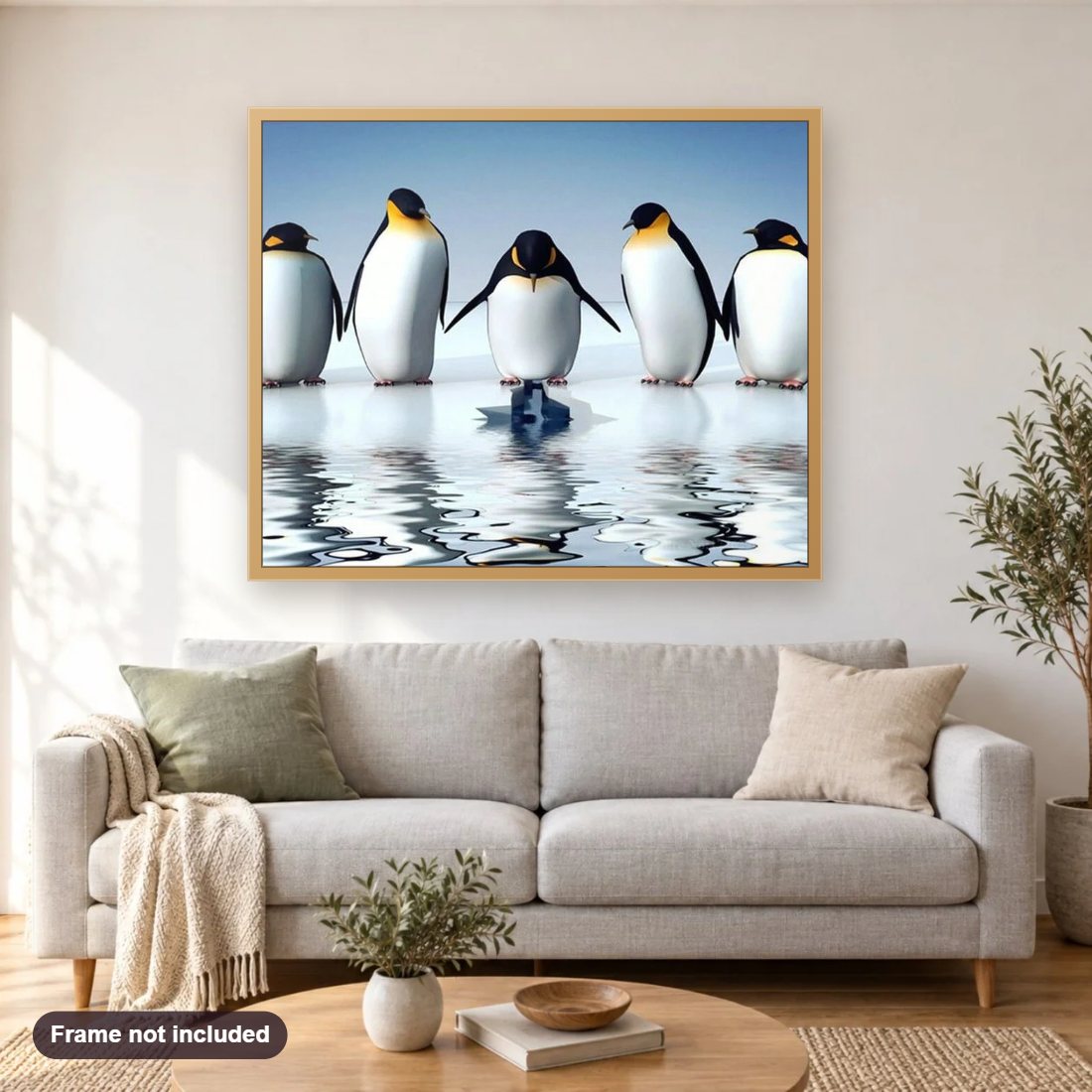 Penguins diamond painting shown framed on a living room wall above a sofa
