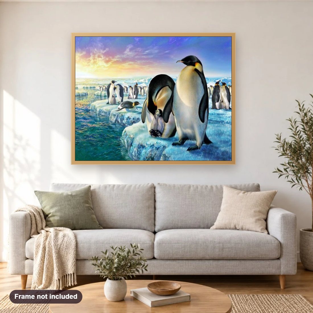 Penguins Family in Iceland diamond painting shown framed on a living room wall above a sofa