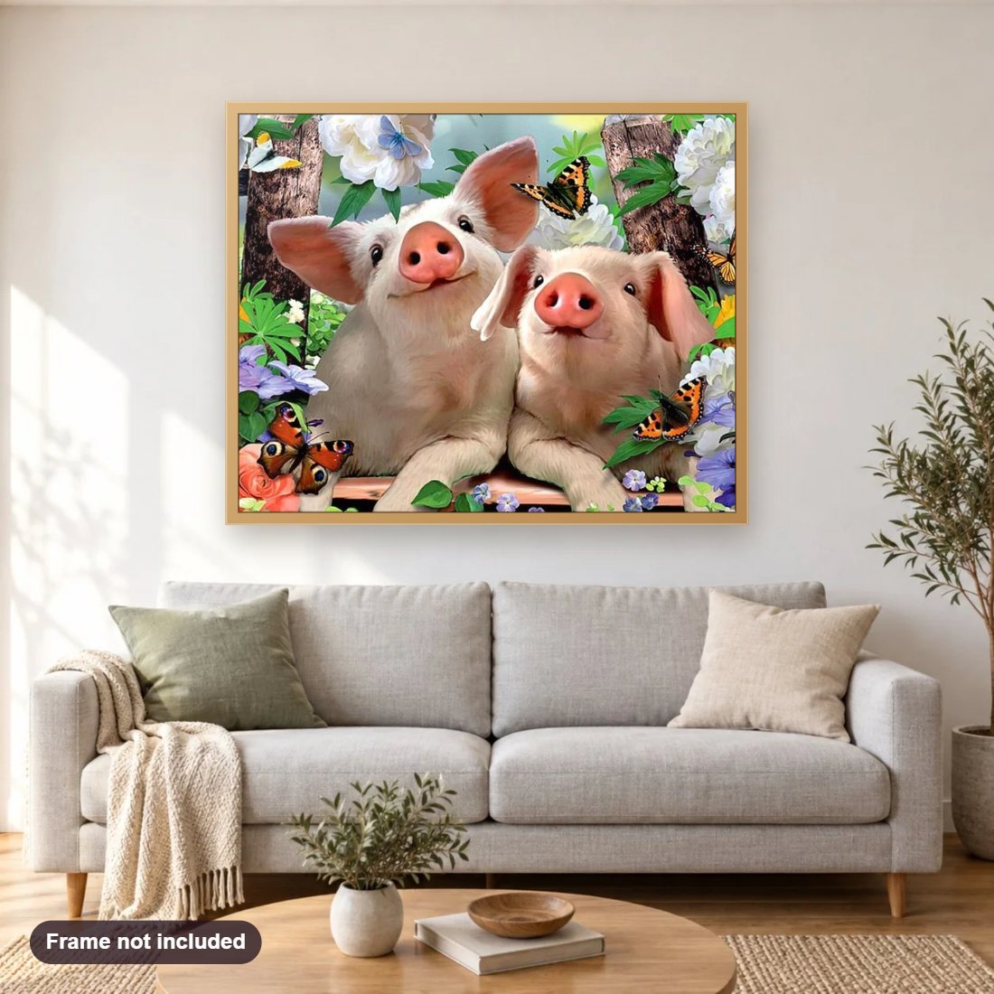 Pigs & Butterflies diamond painting shown framed on a living room wall above a sofa