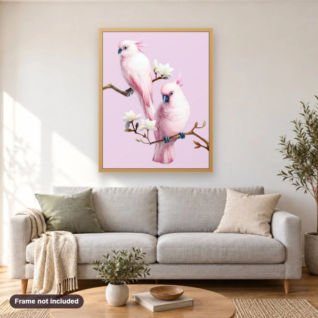 Pink Cockatoos Pair diamond painting shown framed on a living room wall above a sofa
