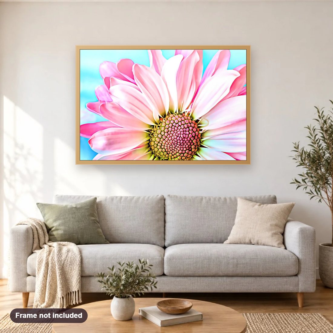 Pink Dahlia diamond painting shown framed on a living room wall above a sofa