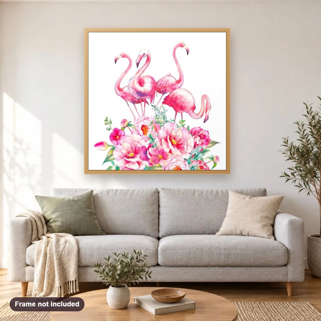 Pink Flamingos & Flowers diamond painting shown framed on a living room wall above a sofa
