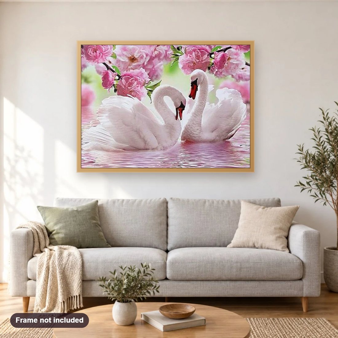 Pink Flowers & Swans in the Lake diamond painting shown framed on a living room wall above a sofa