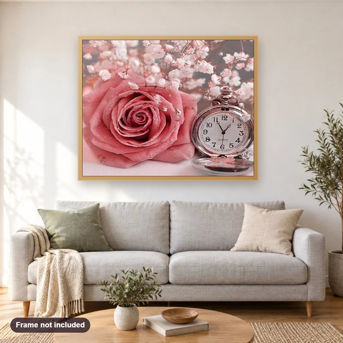 Pink Rose & Clock diamond painting shown framed on a living room wall above a sofa