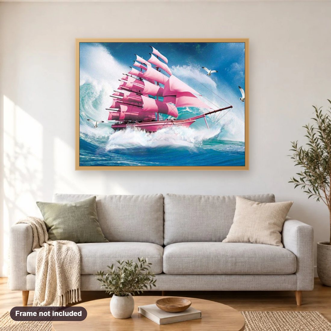 Pink Ship diamond painting shown framed on a living room wall above a sofa
