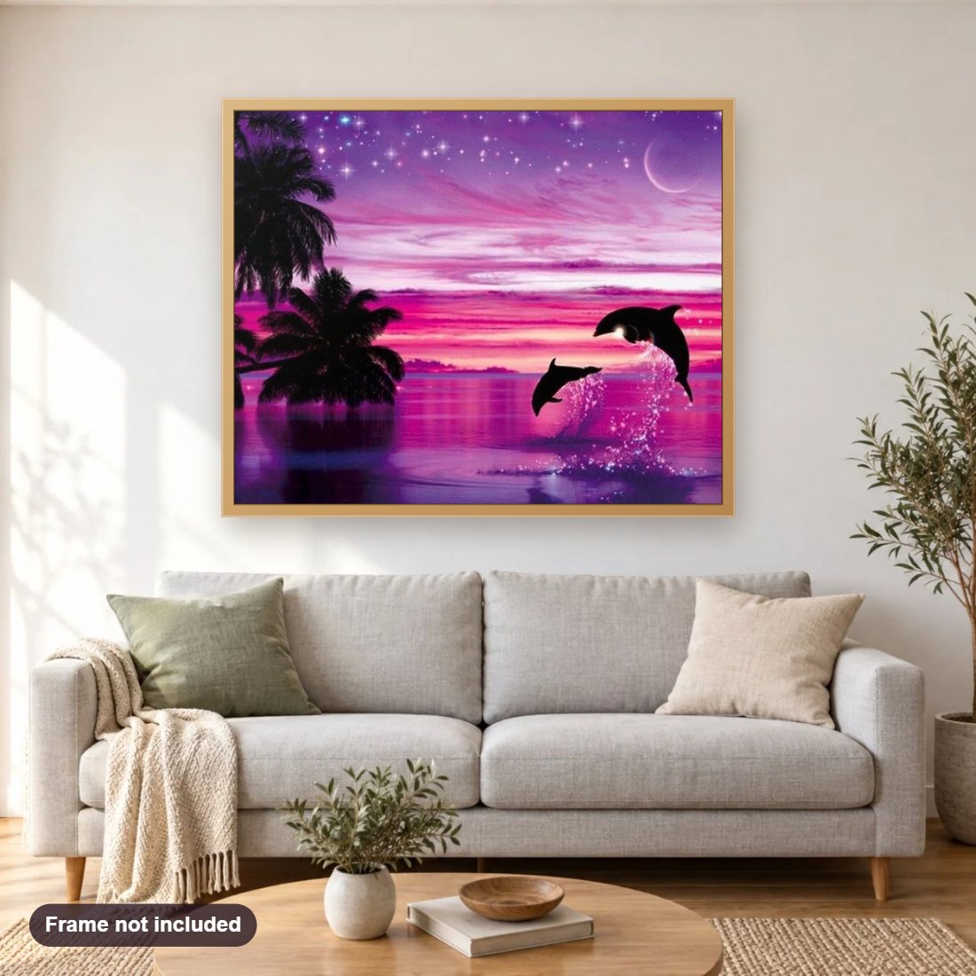 Pink Sky & Dolphins Pair diamond painting shown framed on a living room wall above a sofa