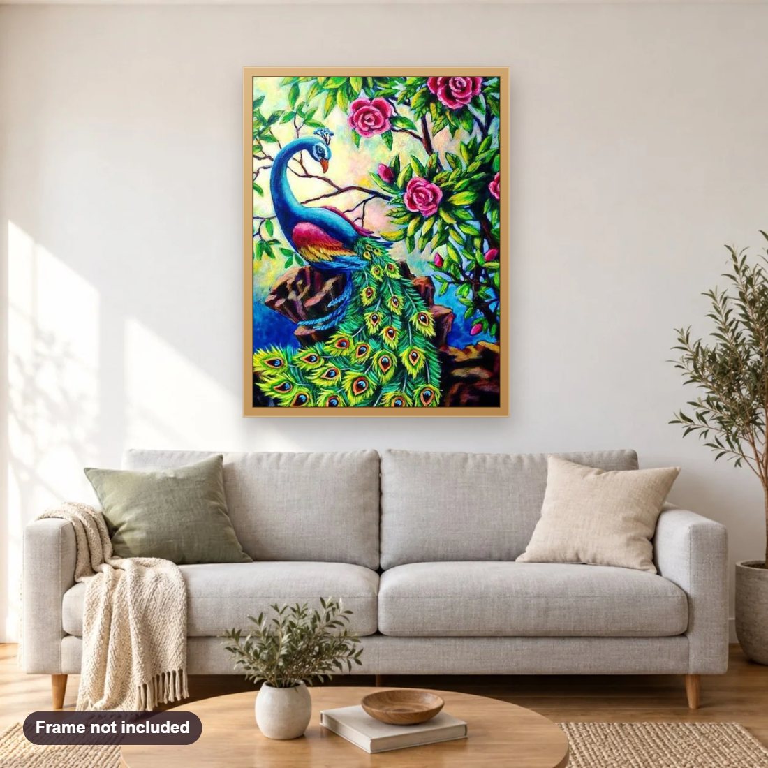 Pretty Peacock & Roses diamond painting shown framed on a living room wall above a sofa