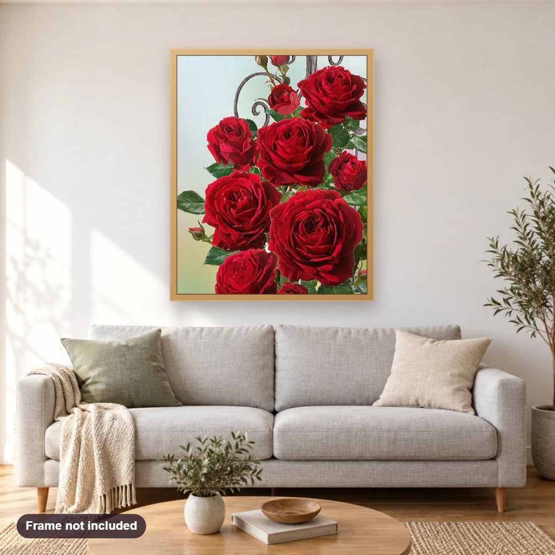 Pretty Red Roses diamond painting shown framed on a living room wall above a sofa