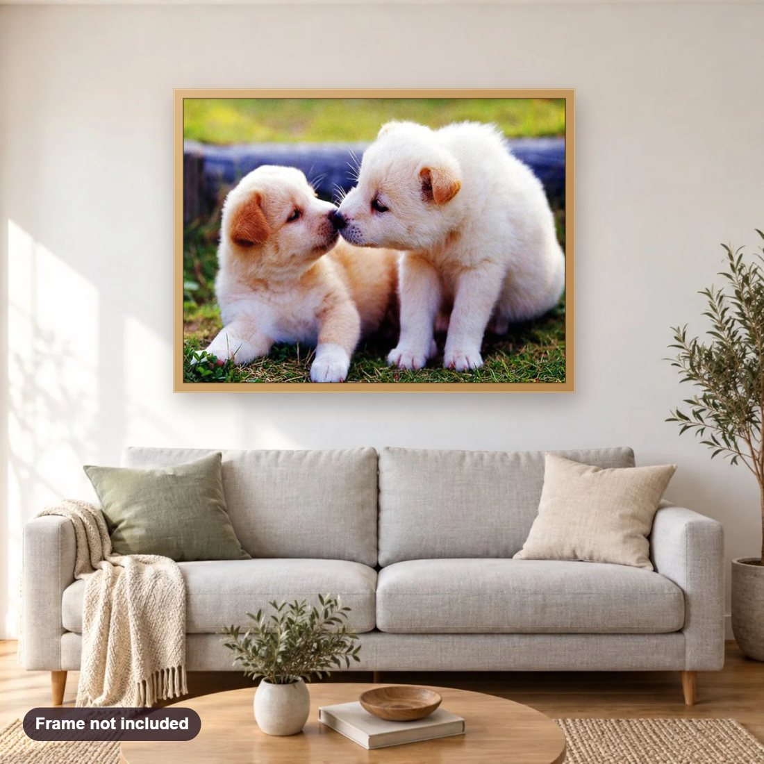 Puppies Kissing diamond painting shown framed on a living room wall above a sofa
