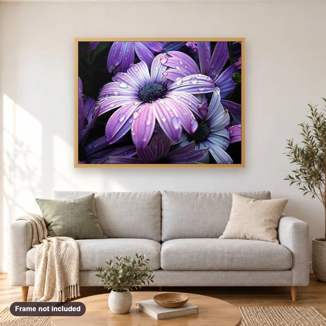 Purple Flowers diamond painting shown framed on a living room wall above a sofa