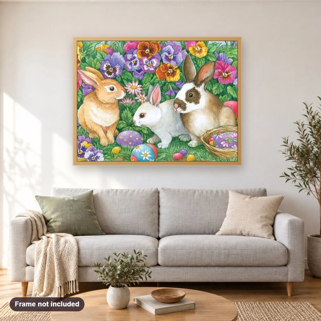 Rabbits & Flowers diamond painting shown framed on a living room wall above a sofa