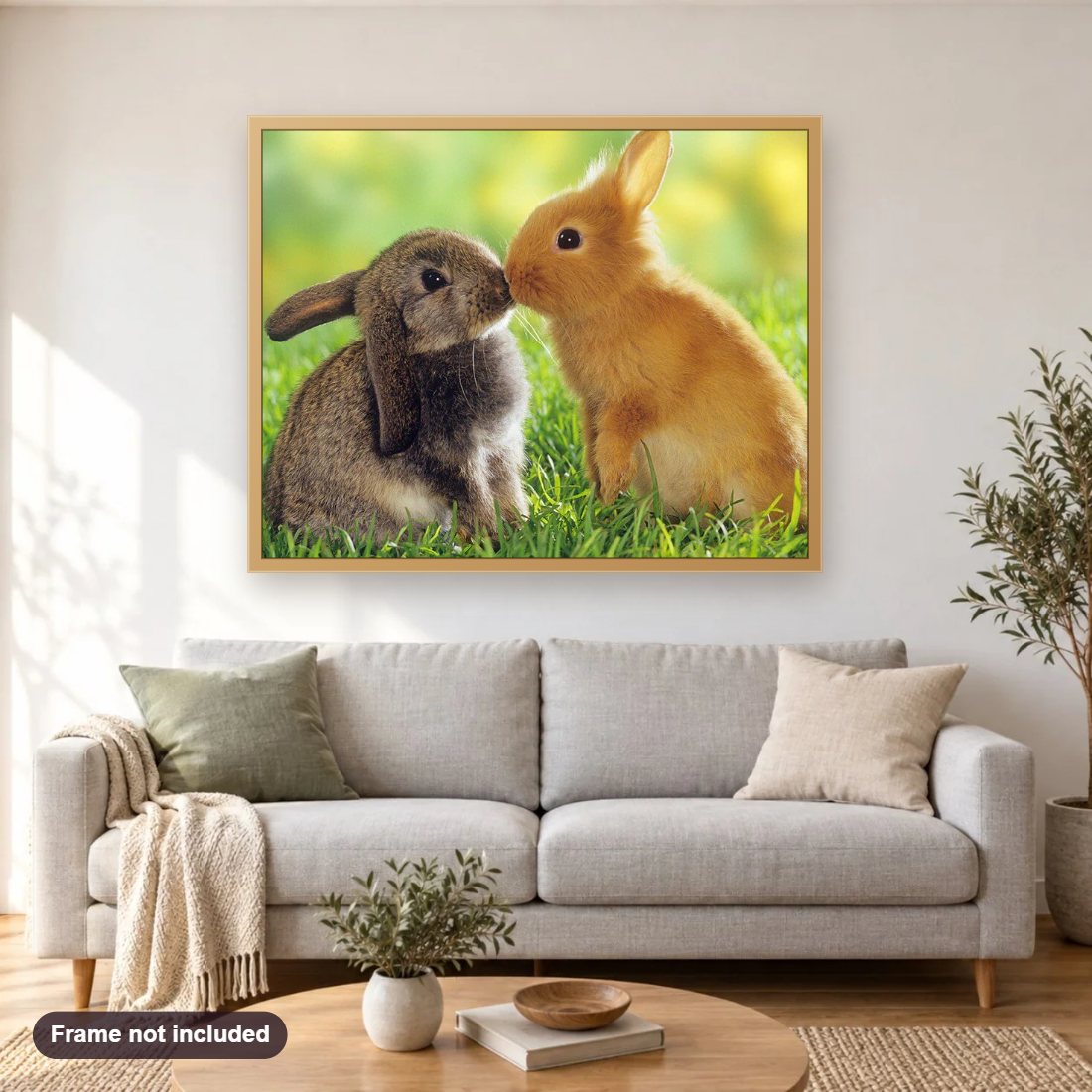 Rabbits Pair diamond painting shown framed on a living room wall above a sofa