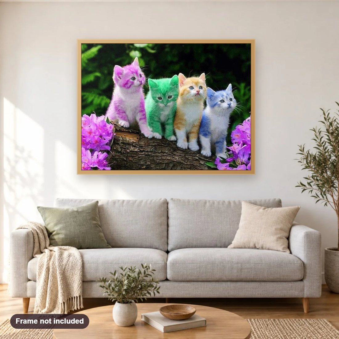 Rainbow Kittens diamond painting shown framed on a living room wall above a sofa