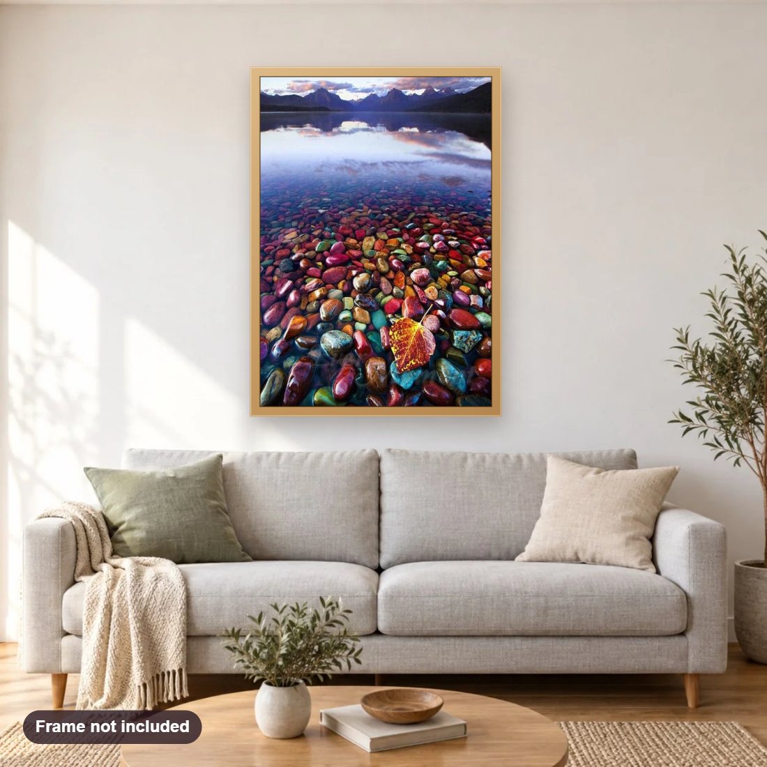 Rainbow Rocks Lake diamond painting shown framed on a living room wall above a sofa