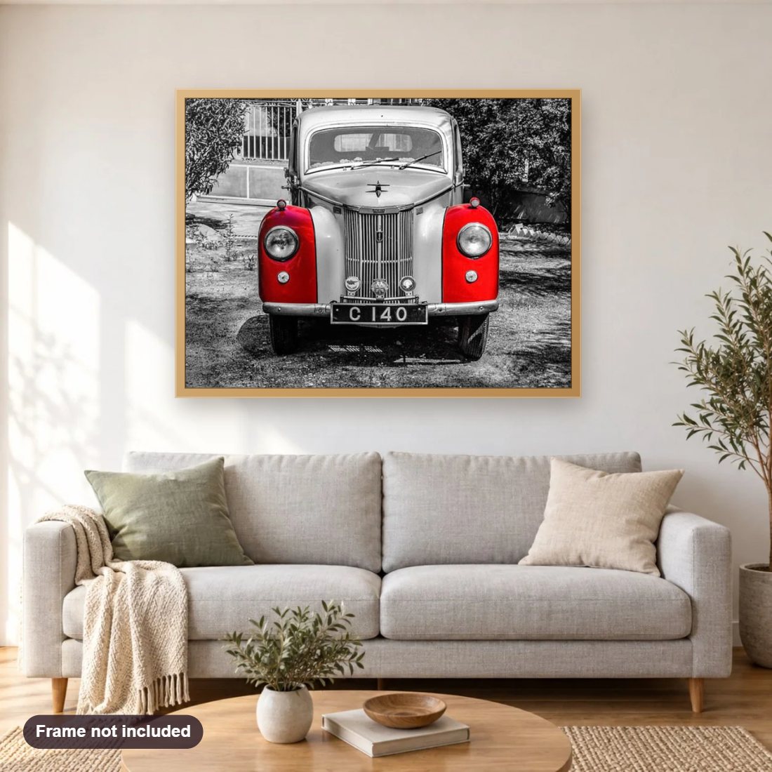 Red & silver vintage car diamond painting shown framed on a living room wall above a sofa