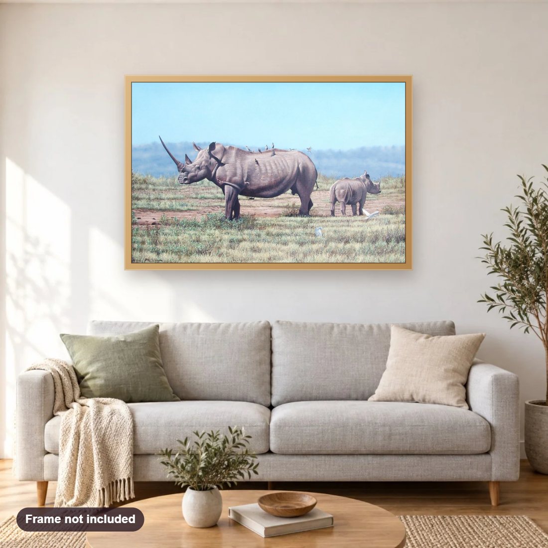 Rhino diamond painting shown framed on a living room wall above a sofa
