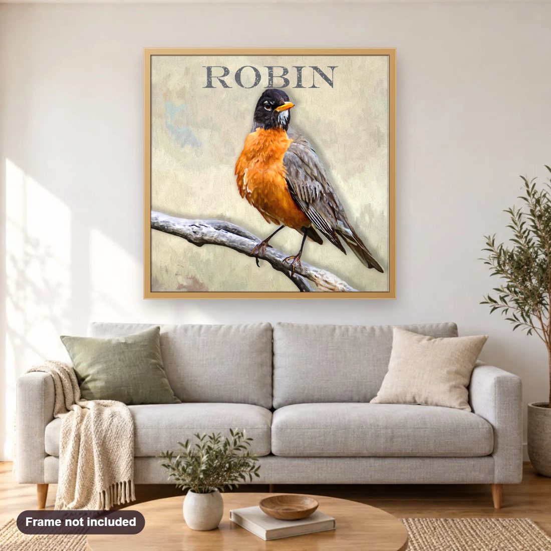 Robin diamond painting shown framed on a living room wall above a sofa