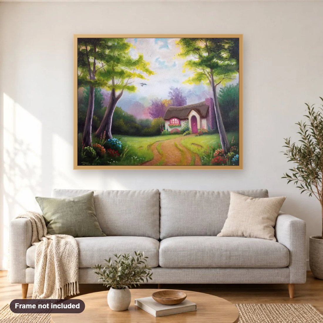 Rose Cottage diamond painting shown framed on a living room wall above a sofa