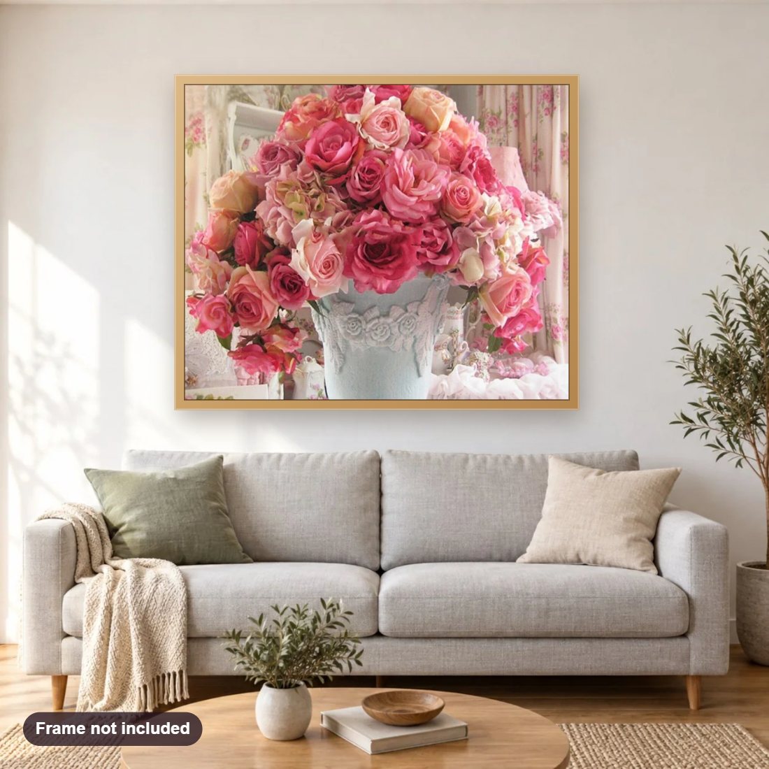 Roses diamond painting shown framed on a living room wall above a sofa