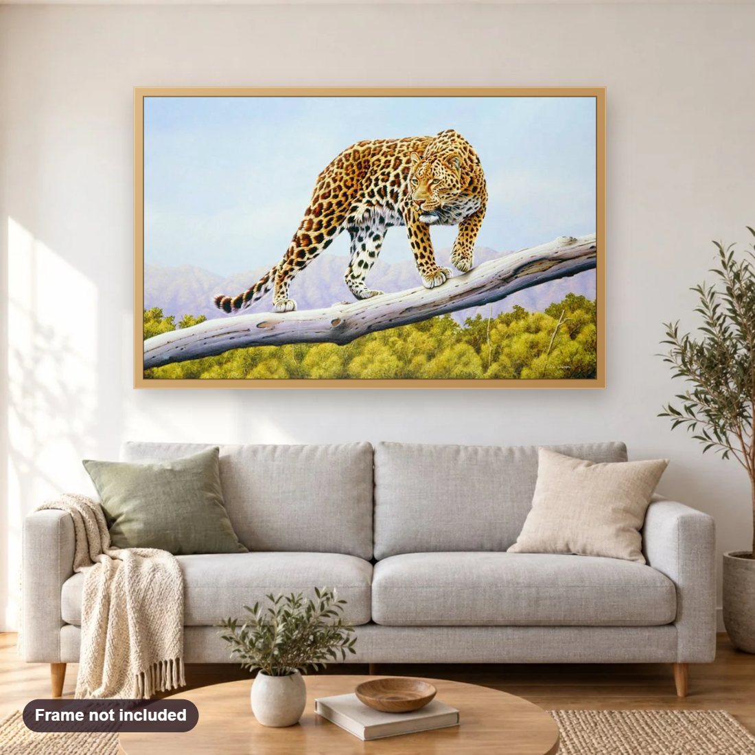 Ruckomechi Leopard diamond painting shown framed on a living room wall above a sofa