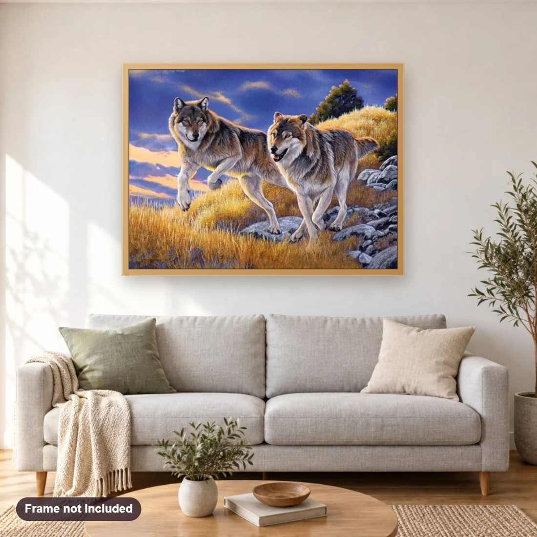Running Wolves diamond painting shown framed on a living room wall above a sofa