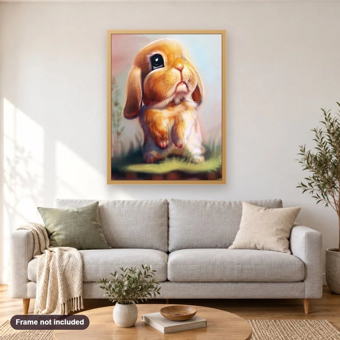 Sad Bunny diamond painting shown framed on a living room wall above a sofa