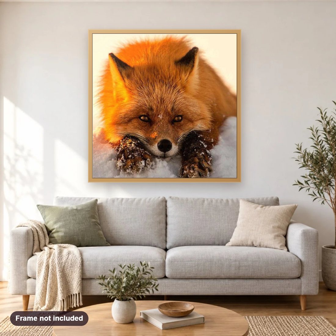 Sad Fox diamond painting shown framed on a living room wall above a sofa