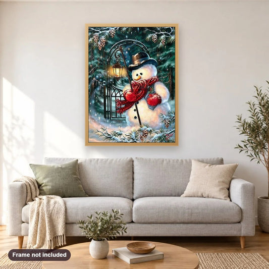 Sad Snowman with Lantern diamond painting shown framed on a living room wall above a sofa
