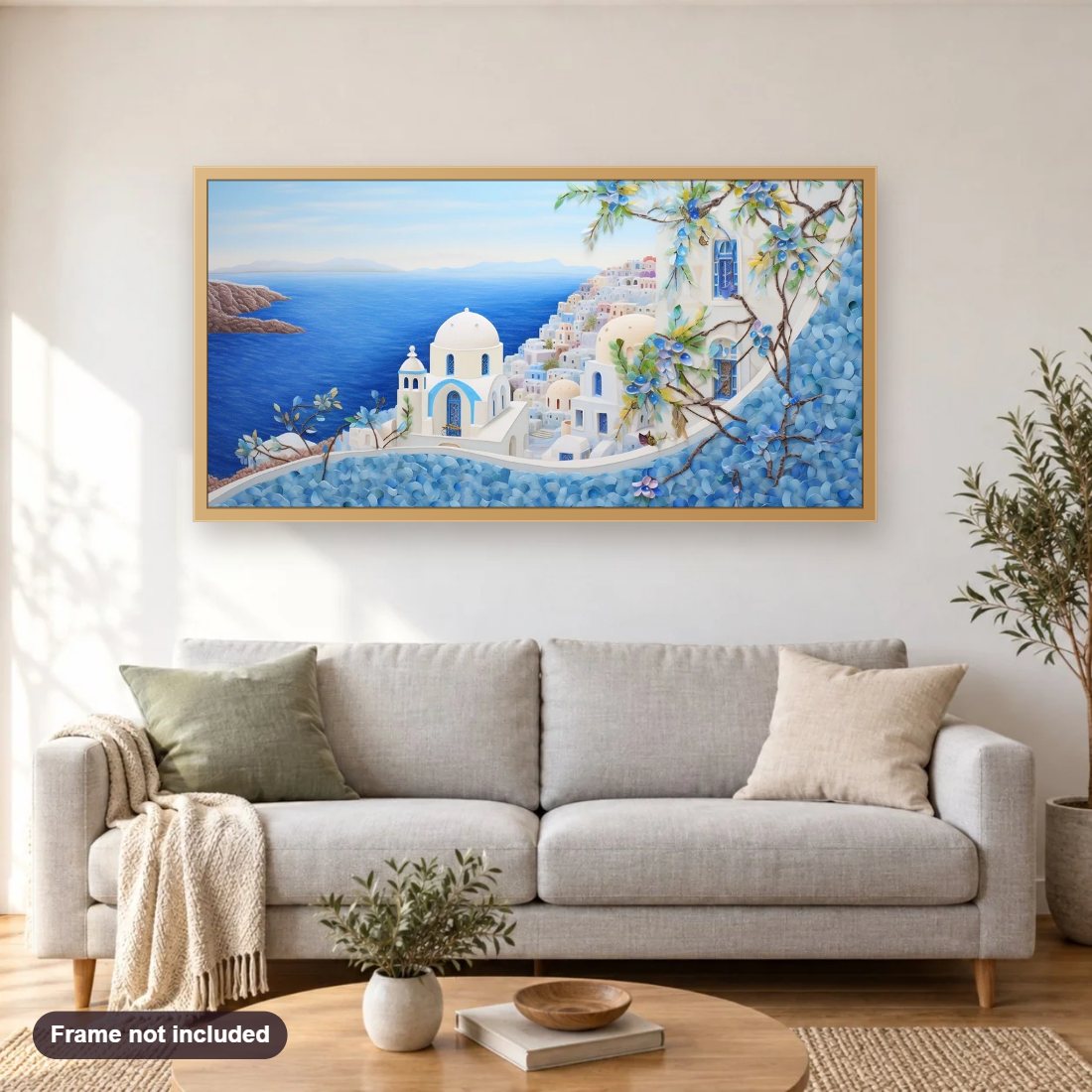 Santorini Island View diamond painting shown framed on a living room wall above a sofa