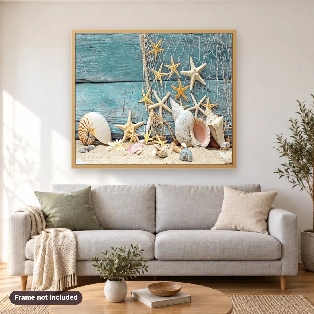 Sea Shells diamond painting shown framed on a living room wall above a sofa