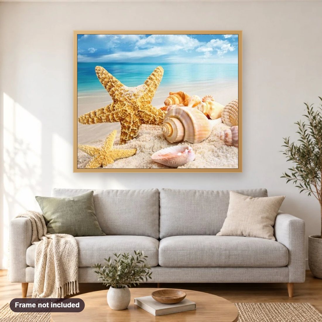 Seashells in the Ocean diamond painting shown framed on a living room wall above a sofa