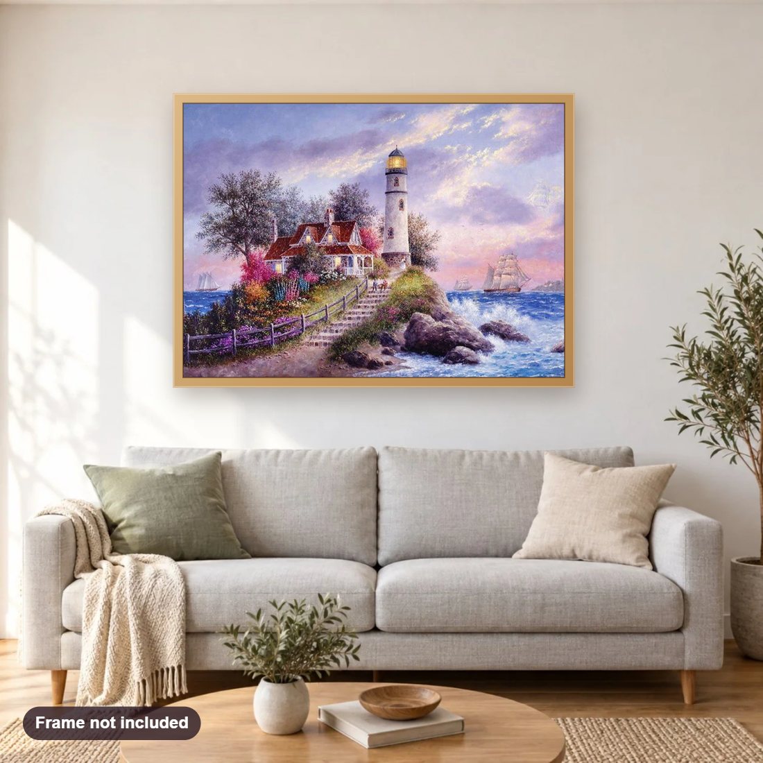 Seaside Light House diamond painting shown framed on a living room wall above a sofa