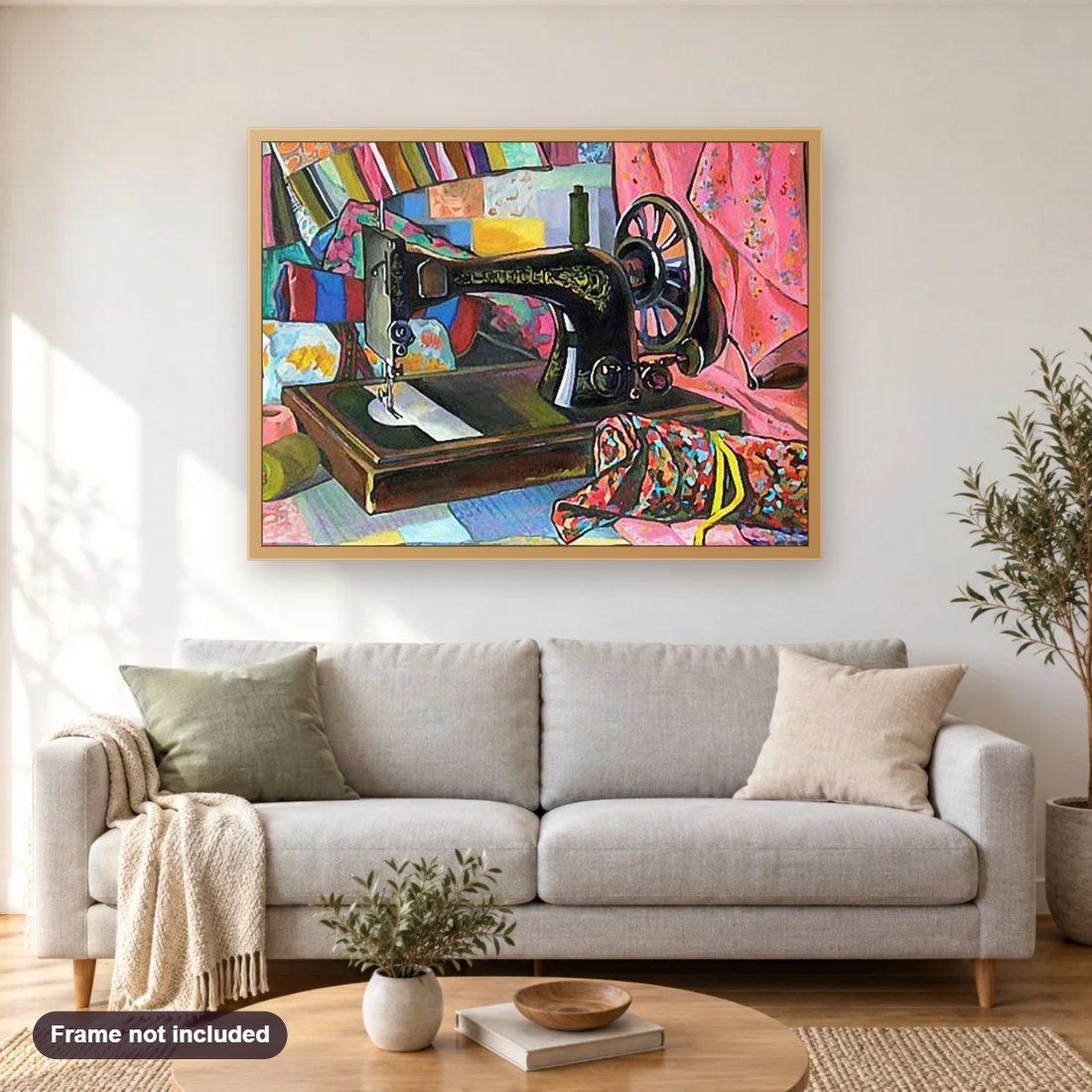 Sewing Machine diamond painting shown framed on a living room wall above a sofa