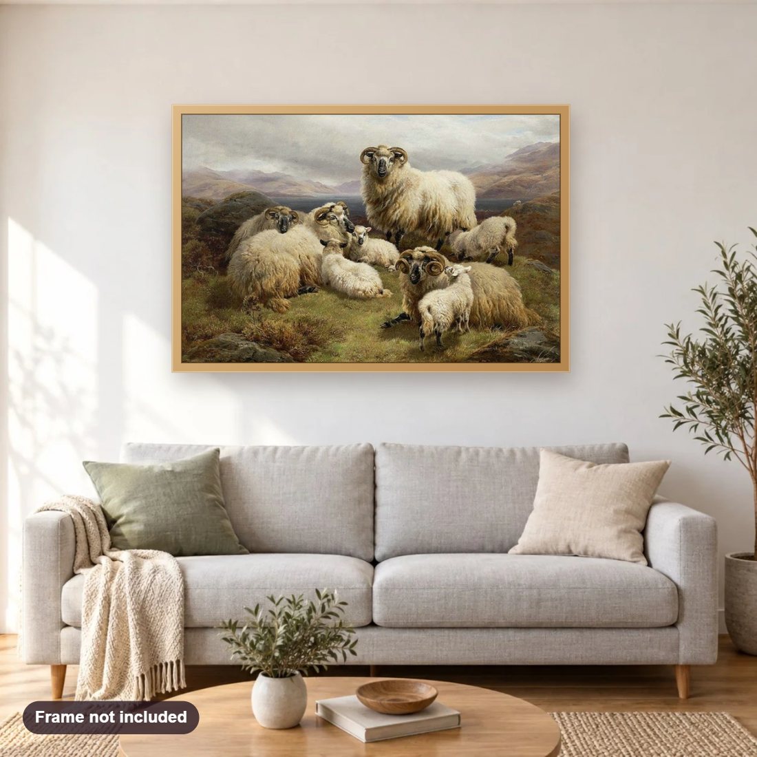 Sheep in the Highlands diamond painting shown framed on a living room wall above a sofa