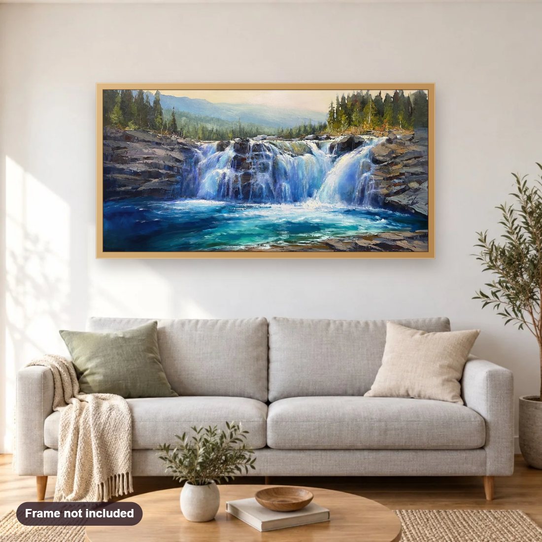 Sheep River Falls diamond painting shown framed on a living room wall above a sofa