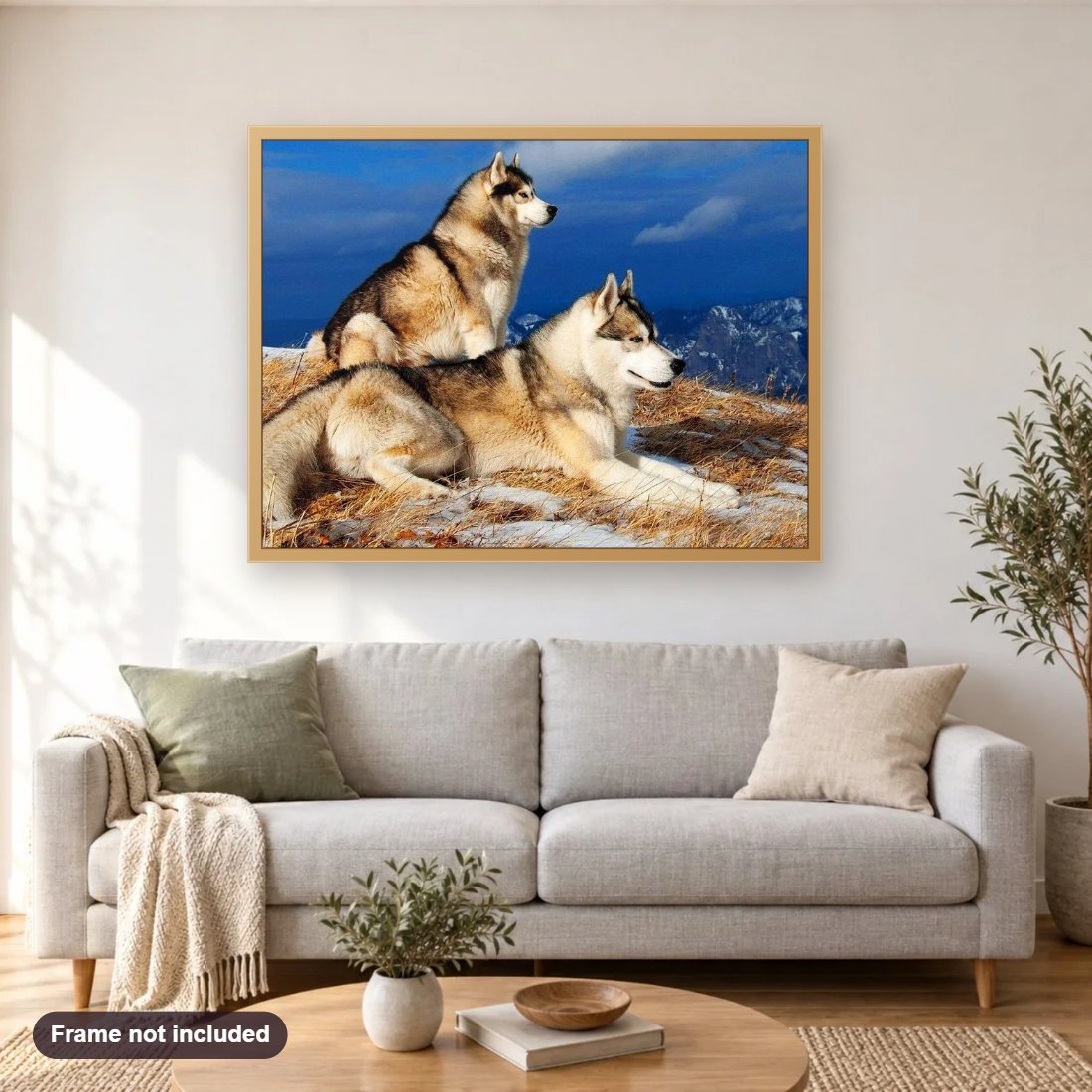 Siberian Husky Pair on Mountains diamond painting shown framed on a living room wall above a sofa