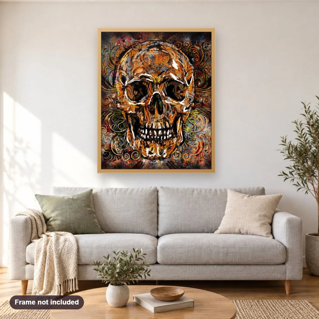 Skull diamond painting shown framed on a living room wall above a sofa