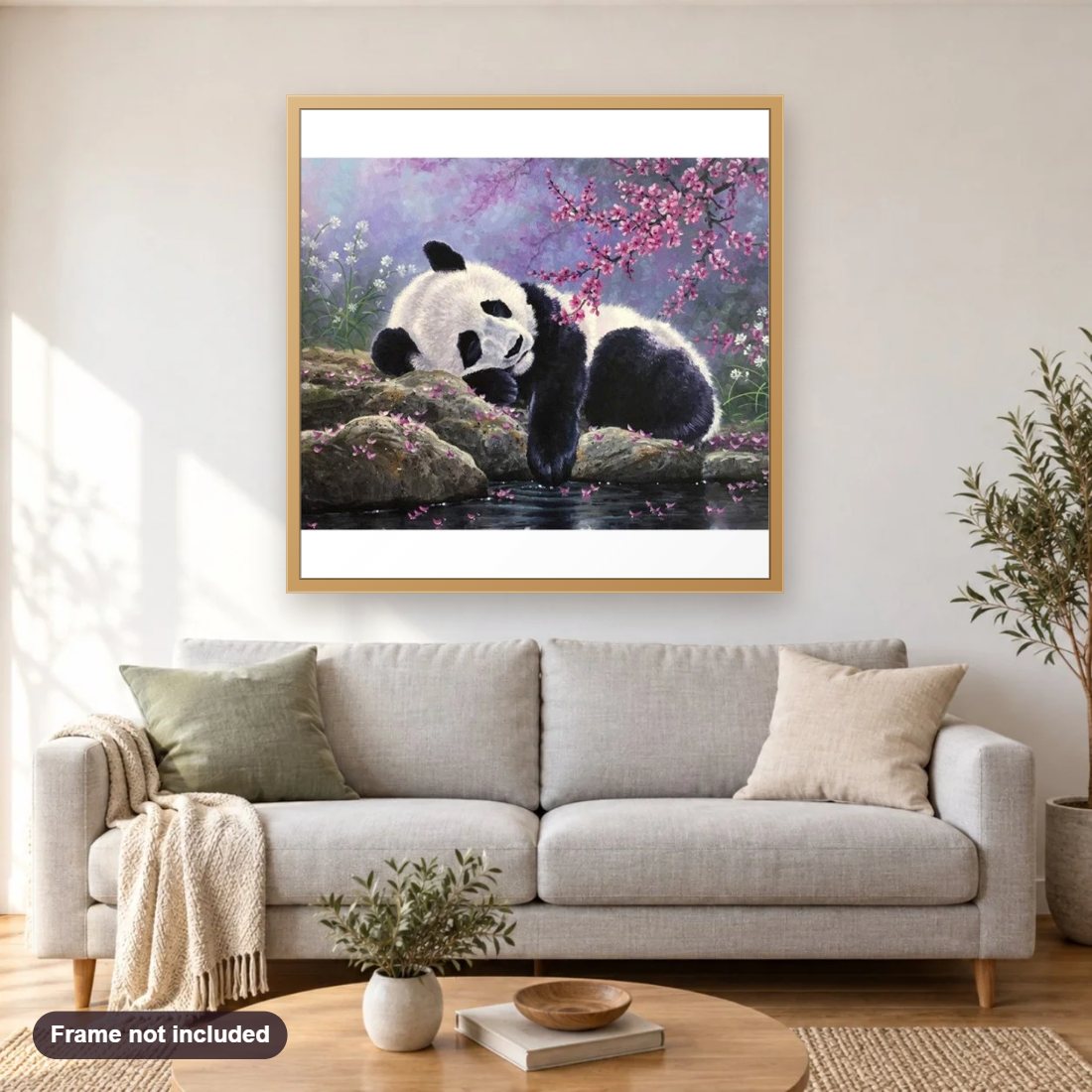 Sleeping Panda diamond painting shown framed on a living room wall above a sofa