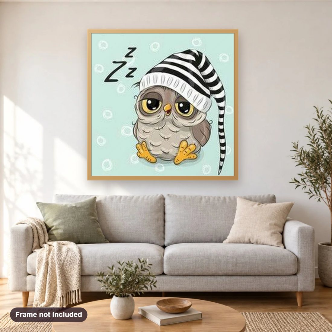 Sleepy Owl diamond painting shown framed on a living room wall above a sofa