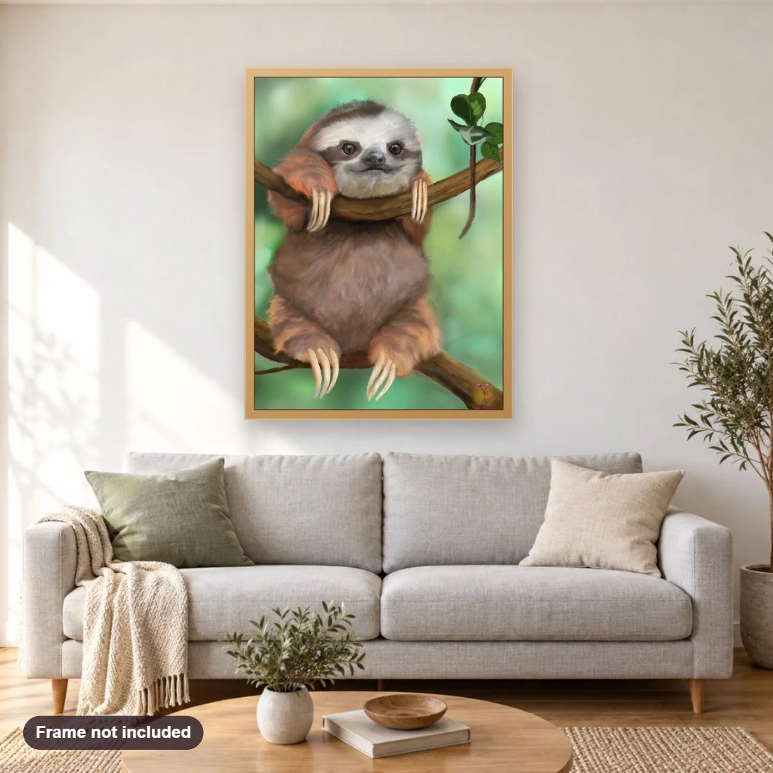 Sloth diamond painting shown framed on a living room wall above a sofa