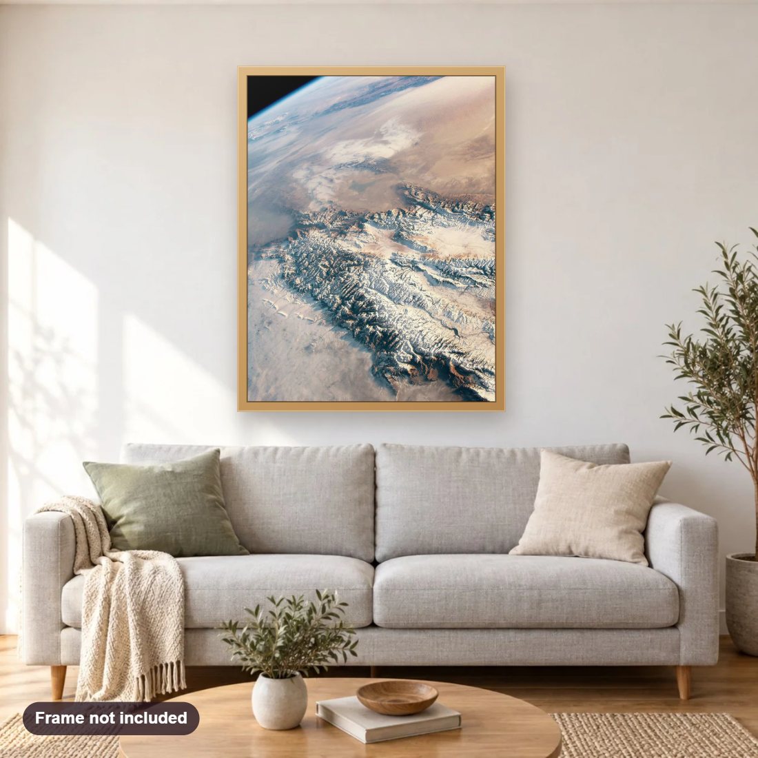 Snow and Sand in Central Asia diamond painting shown framed on a living room wall above a sofa