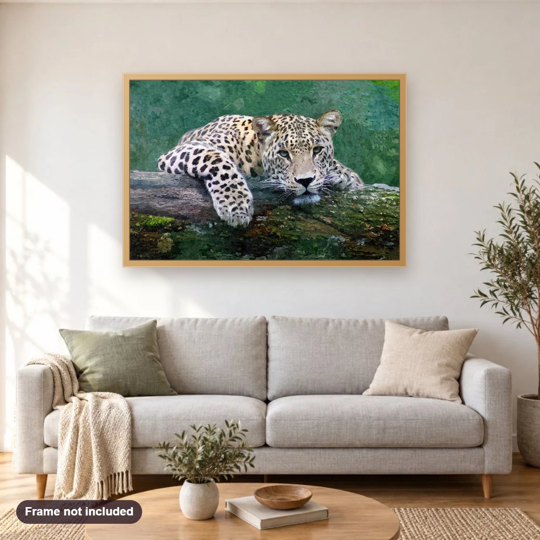 Snow Leopard diamond painting shown framed on a living room wall above a sofa