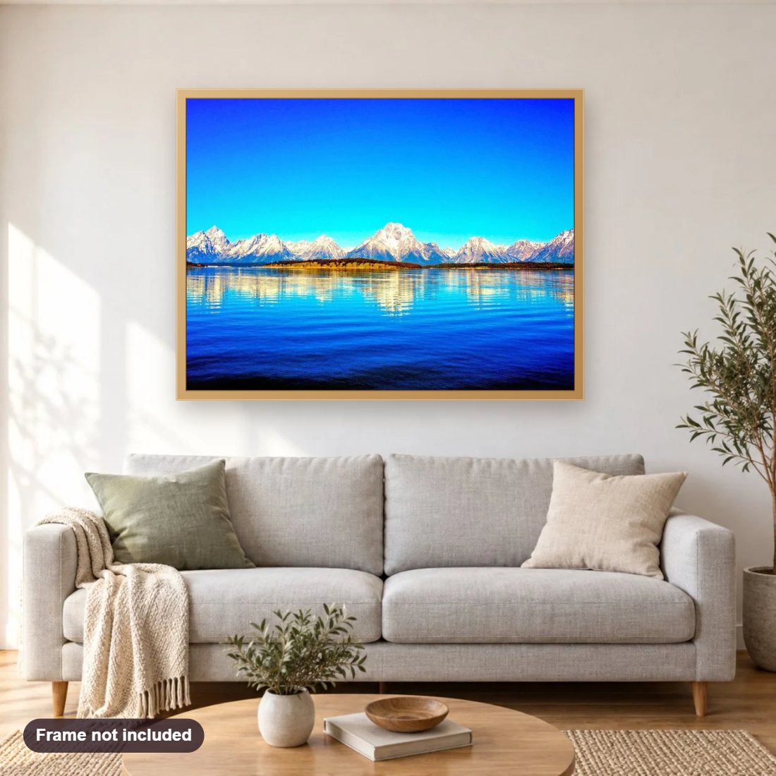 Snow Mountains & Beautiful Lake diamond painting shown framed on a living room wall above a sofa