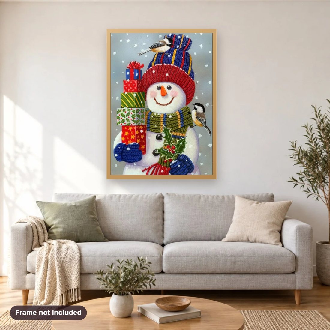 Snowman with Christmas Gifts diamond painting shown framed on a living room wall above a sofa