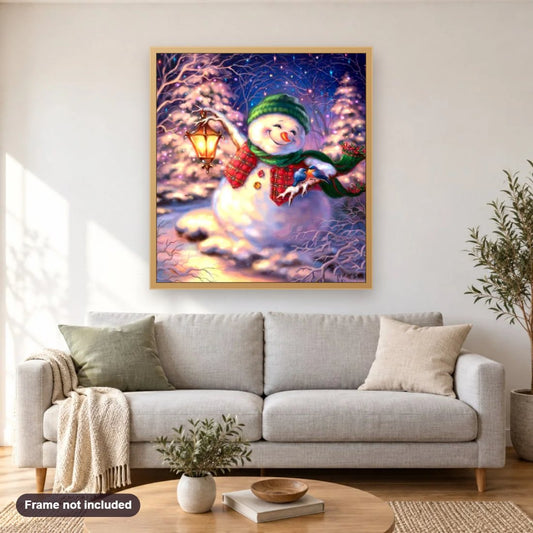 Snowman with Lantern on Christmas Night diamond painting shown framed on a living room wall above a sofa