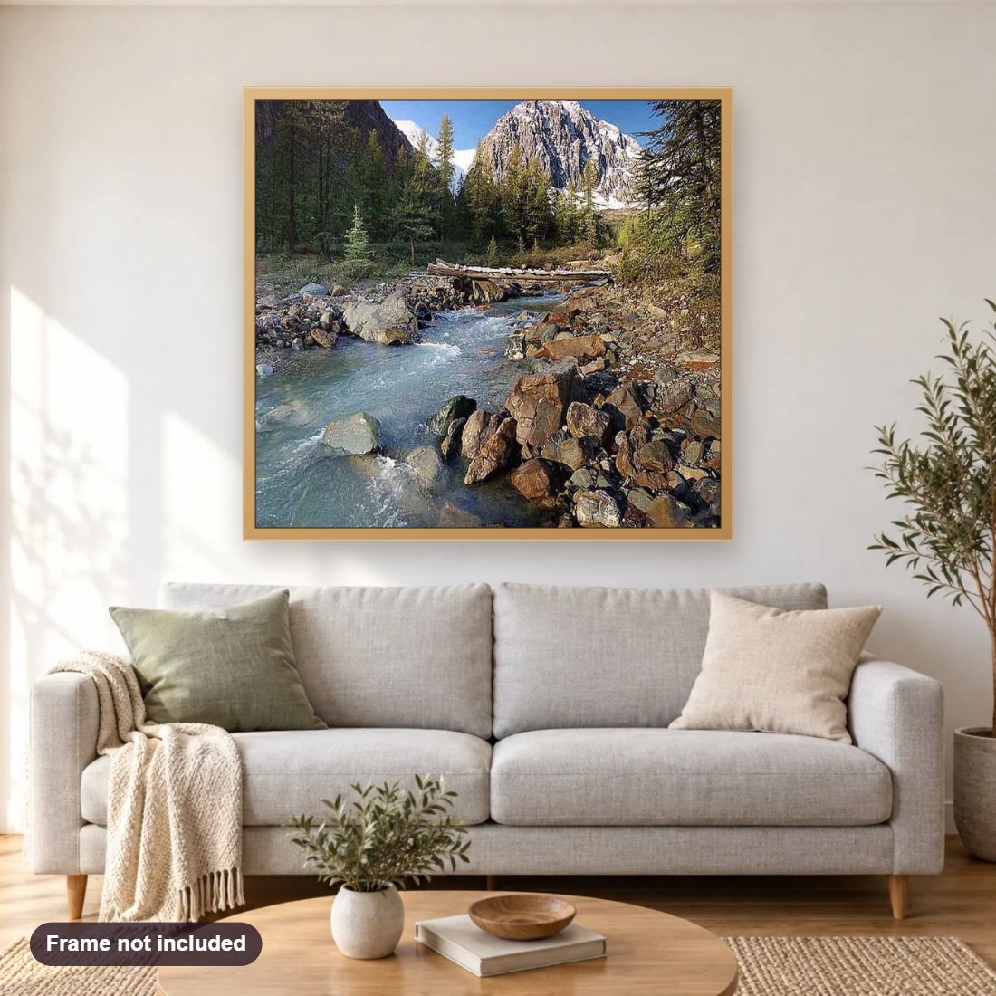 Snowy Mountain & Water Stream diamond painting shown framed on a living room wall above a sofa