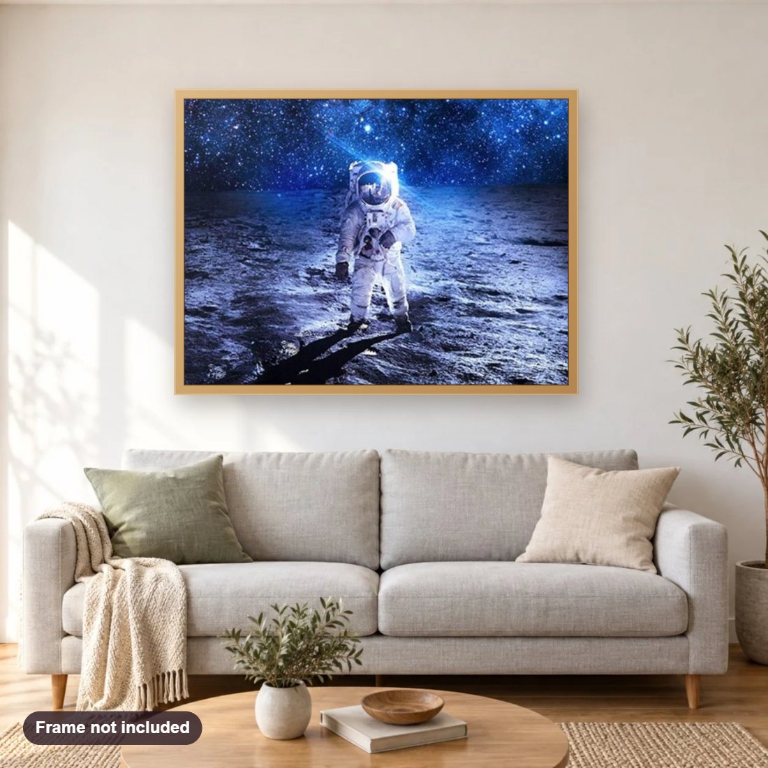 Space Astronaut diamond painting shown framed on a living room wall above a sofa