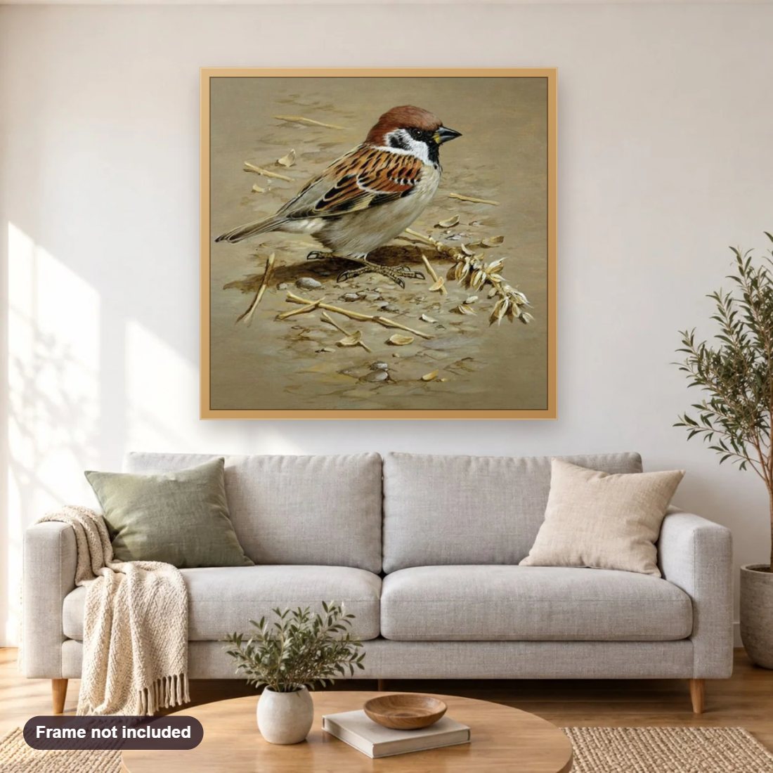 Sparrow diamond painting shown framed on a living room wall above a sofa