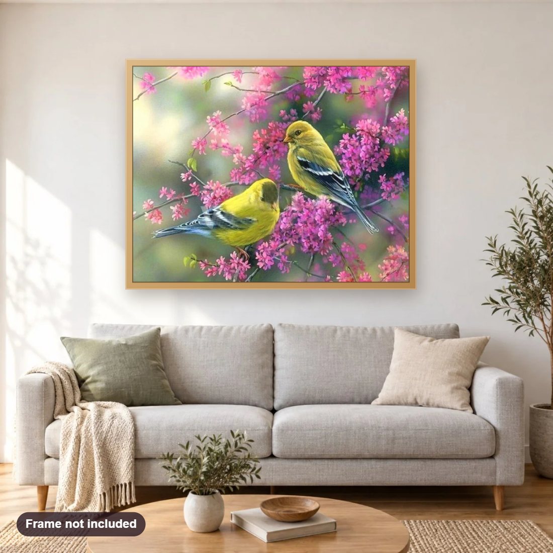 Sparrows diamond painting shown framed on a living room wall above a sofa