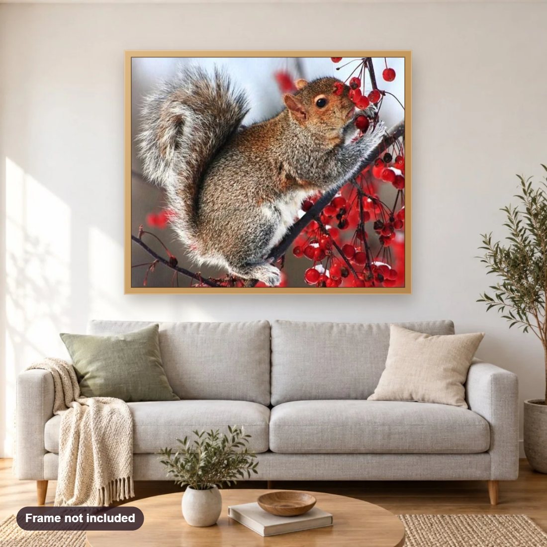 Squirrel on Tree diamond painting shown framed on a living room wall above a sofa